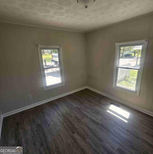 359 Hoyt St, Cornelia, GA 30531 - spare room featuring plenty of natural light, dark wood finished floors, baseboards, a textured ceiling, and crown molding