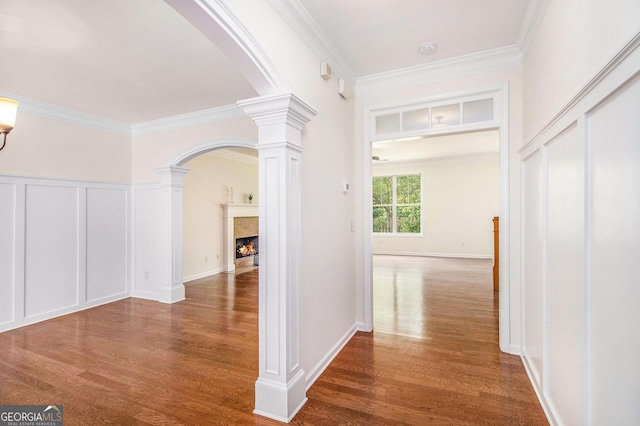 14 Mcgregor Ln, Dawsonville, GA 30534 - hall with ornate columns, arched walkways, ornamental molding, wood finished floors, and a decorative wall
