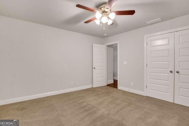 26 Trillium Ln, Acworth, GA 30101 - unfurnished bedroom featuring carpet, baseboards, a closet, and ceiling fan