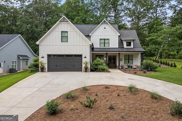 2490 S Carroll St, Villa Rica, GA 30180 - modern farmhouse featuring covered porch, board and batten siding, concrete driveway, and a garage