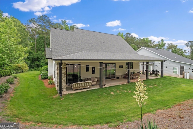 2490 S Carroll St, Villa Rica, GA 30180 - back of property with a patio, a lawn, and a shingled roof