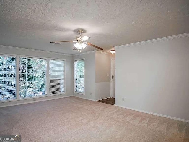 510 Berkeley Woods Dr, Duluth, GA 30096 - empty room with carpet flooring, ornamental molding, ceiling fan, baseboards, and a textured ceiling