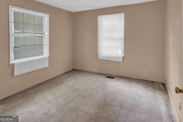 507 W 35th St, Savannah, GA 31415 - empty room featuring concrete floors and baseboards