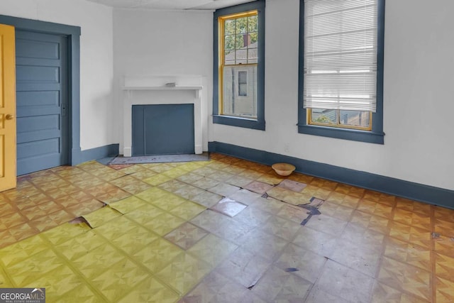 507 W 35th St, Savannah, GA 31415 - unfurnished living room with baseboards