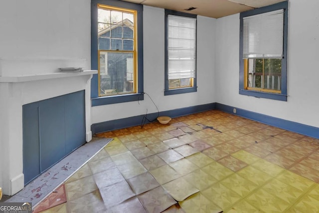 507 W 35th St, Savannah, GA 31415 - spare room featuring healthy amount of natural light and baseboards