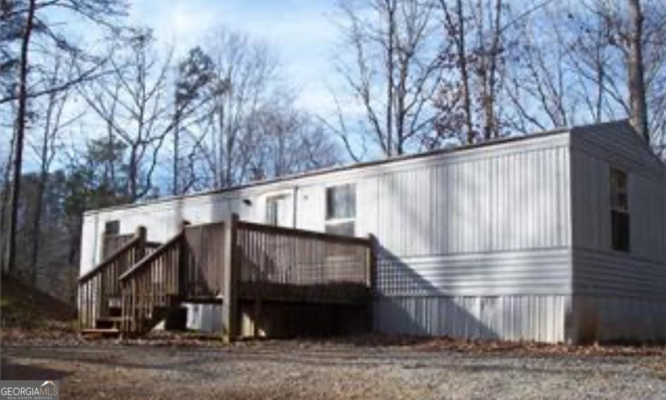 1228 Winters Mountain Rd, Dahlonega, GA 30533 - back of property featuring a deck and stairway