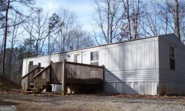 1228 Winters Mountain Rd, Dahlonega, GA 30533 - back of property featuring a deck and stairway