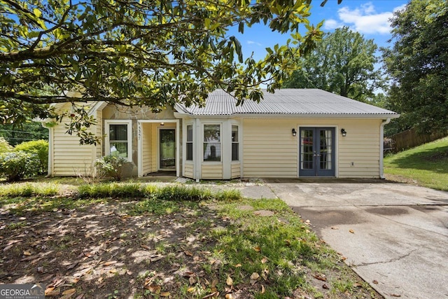 3357 Saddleton Way, Douglasville, GA 30134 - view of front of property with french doors and metal roof