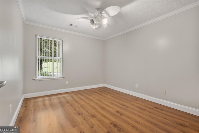 3357 Saddleton Way, Douglasville, GA 30134 - unfurnished room featuring wood finished floors, baseboards, a ceiling fan, and crown molding