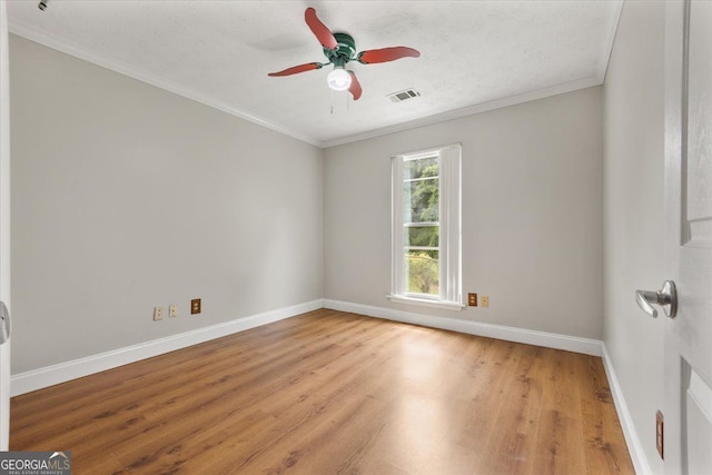 3357 Saddleton Way, Douglasville, GA 30134 - spare room featuring light wood-style flooring, baseboards, crown molding, and a ceiling fan