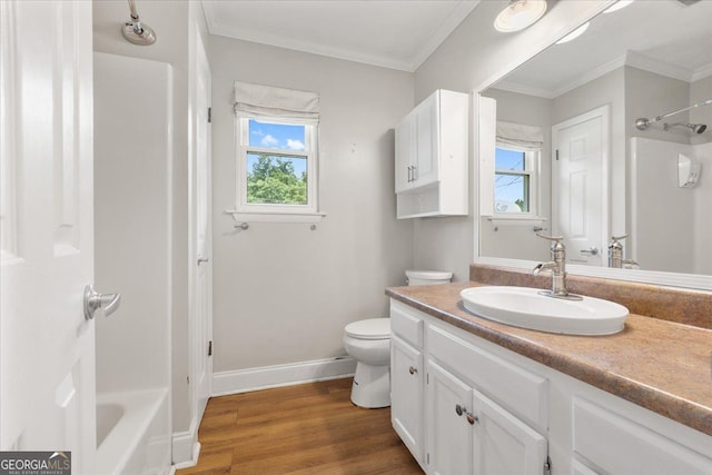 3357 Saddleton Way, Douglasville, GA 30134 - bathroom featuring vanity, toilet, baseboards, wood finished floors, and crown molding