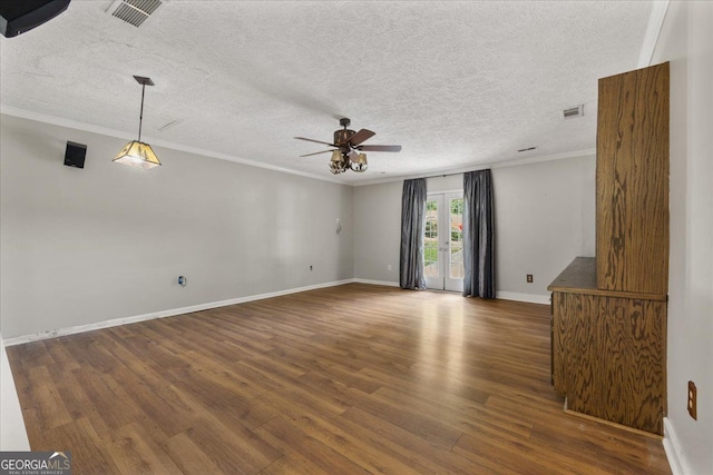 3357 Saddleton Way, Douglasville, GA 30134 - empty room with a ceiling fan, wood finished floors, crown molding, baseboards, and a textured ceiling