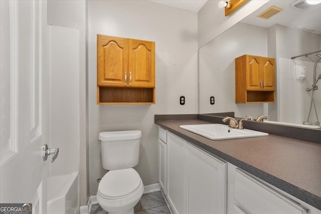 3357 Saddleton Way, Douglasville, GA 30134 - bathroom with vanity, toilet, tile patterned floors, and baseboards