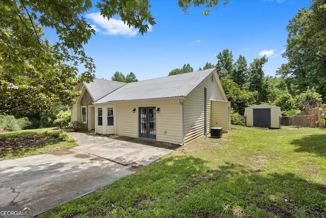 3357 Saddleton Way, Douglasville, GA 30134 - view of front of property with french doors, metal roof, central AC unit, and a patio area