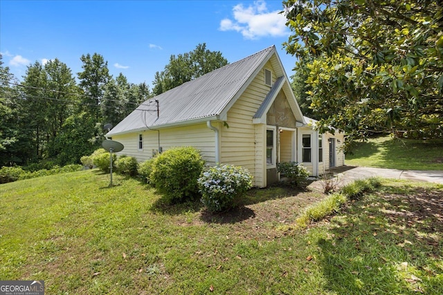 3357 Saddleton Way, Douglasville, GA 30134 - view of property exterior featuring a lawn and metal roof