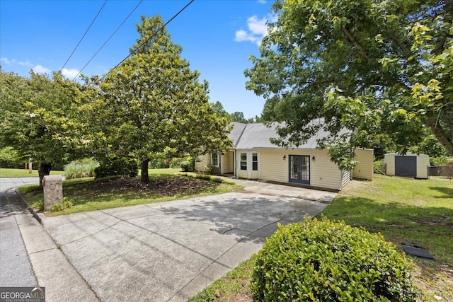 3357 Saddleton Way, Douglasville, GA 30134 - view of front of house with french doors, driveway, and a front lawn