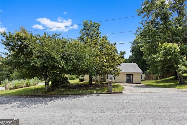 3357 Saddleton Way, Douglasville, GA 30134 - view of property hidden behind natural elements with driveway, french doors, and a front lawn