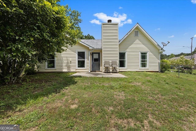 3357 Saddleton Way, Douglasville, GA 30134 - rear view of property featuring a chimney and a patio