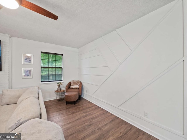 150 Archer Rd, Colbert, GA 30628 - living room with a textured ceiling, wood finished floors, ceiling fan, and baseboards