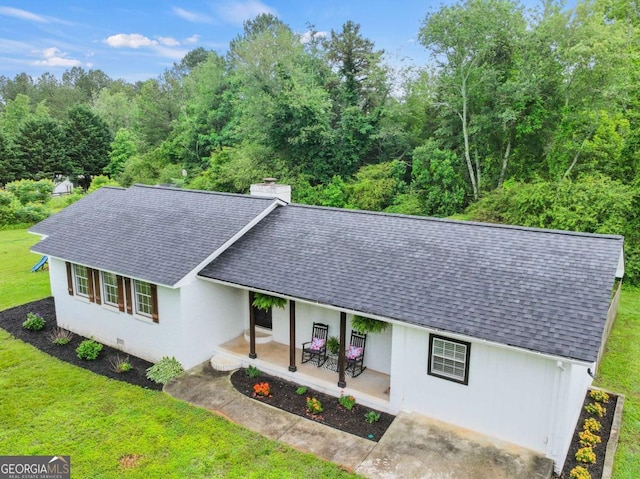 150 Archer Rd, Colbert, GA 30628 - ranch-style house with a shingled roof, a front lawn, a chimney, stucco siding, and covered porch