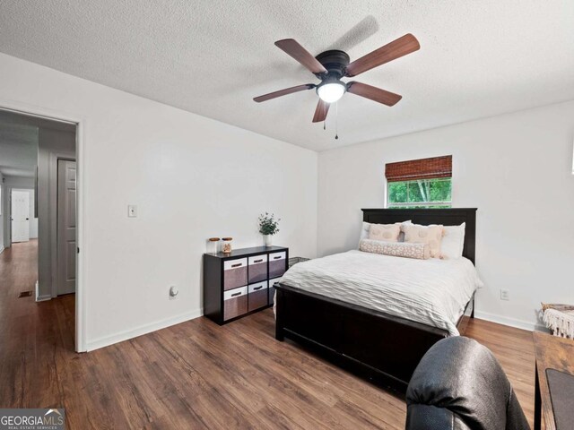 150 Archer Rd, Colbert, GA 30628 - bedroom featuring wood finished floors, baseboards, a textured ceiling, and ceiling fan