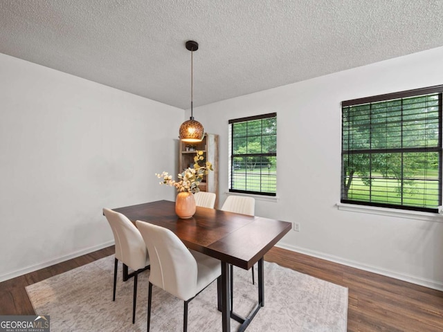 150 Archer Rd, Colbert, GA 30628 - dining area with a textured ceiling, wood finished floors, and baseboards