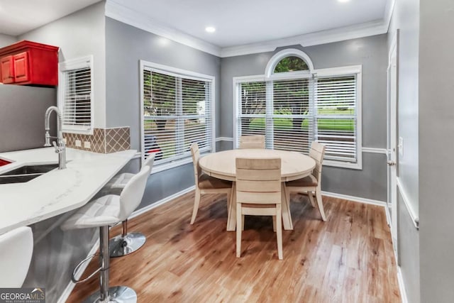 3898 Heritage Oaks Dr, Powder Springs, GA 30127 - dining room featuring ornamental molding, light wood-type flooring, baseboards, and recessed lighting