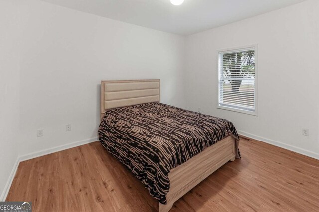 3898 Heritage Oaks Dr, Powder Springs, GA 30127 - bedroom with wood finished floors and baseboards