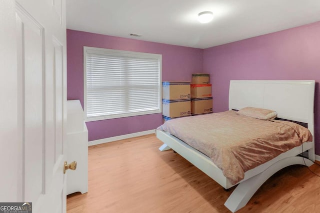 3898 Heritage Oaks Dr, Powder Springs, GA 30127 - bedroom with wood finished floors and baseboards