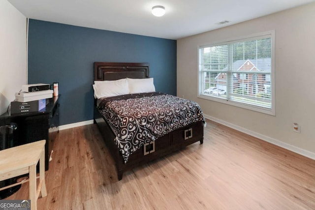 3898 Heritage Oaks Dr, Powder Springs, GA 30127 - bedroom featuring wood finished floors and baseboards