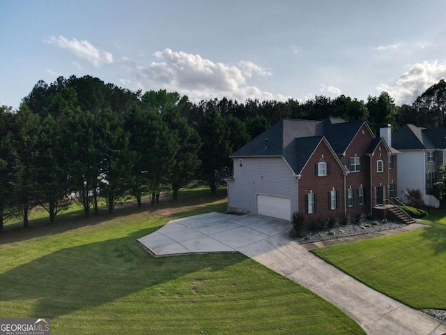 3898 Heritage Oaks Dr, Powder Springs, GA 30127 - view of side of property with an attached garage, concrete driveway, a yard, and brick siding