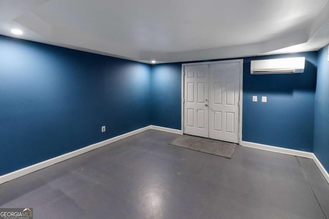 3898 Heritage Oaks Dr, Powder Springs, GA 30127 - unfurnished bedroom featuring a wall unit AC, finished concrete flooring, baseboards, recessed lighting, and a closet