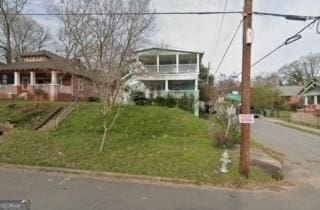 415 Hopkins St SW, Atlanta, GA 30310 - view of front facade with a front lawn and covered porch