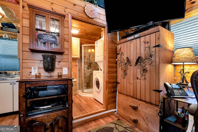 76 Hidden Valley Rd, Cleveland, GA 30528 - laundry area featuring stacked washer and clothes dryer and wood finished floors