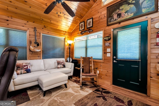 76 Hidden Valley Rd, Cleveland, GA 30528 - living room featuring lofted ceiling, wooden walls, a ceiling fan, wooden ceiling, and wood finished floors