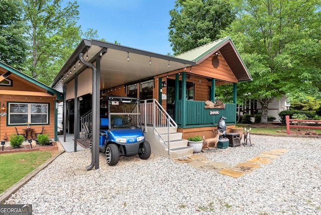 76 Hidden Valley Rd, Cleveland, GA 30528 - view of front of home with a porch and metal roof