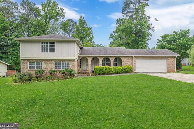 3947 Veracruz Ct, Decatur, GA 30034 - split level home with a front lawn, a garage, driveway, a porch, and brick siding