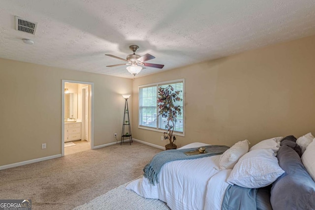 3947 Veracruz Ct, Decatur, GA 30034 - bedroom featuring light colored carpet, baseboards, a textured ceiling, a ceiling fan, and ensuite bathroom
