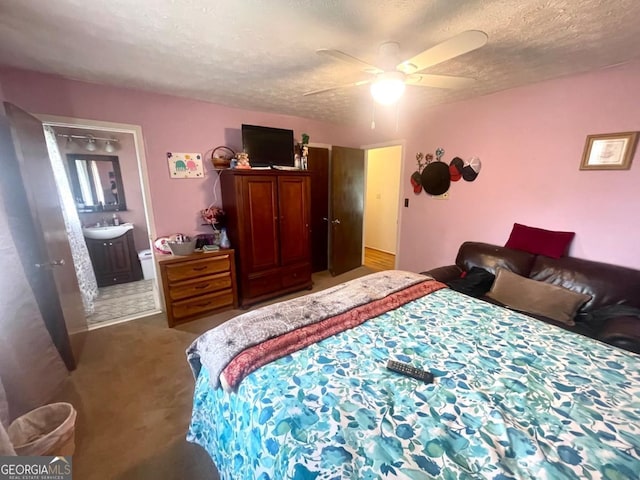 3750 Dial Mill Rd NE, Conyers, GA 30013 - carpeted bedroom with a textured ceiling, ensuite bath, a sink, and ceiling fan