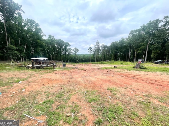 3750 Dial Mill Rd NE, Conyers, GA 30013 - view of yard with a forest view