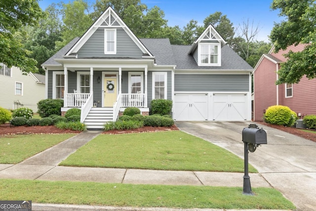 7246 Grand Reunion Dr, Hoschton, GA 30548 - view of front of property with driveway, a shingled roof, a porch, a front yard, and a garage