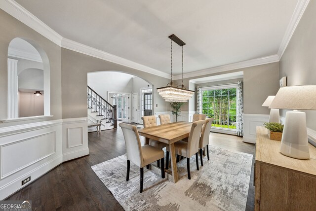 115 Hopewell Grove Dr, Milton, GA 30004 - dining space with arched walkways, ornamental molding, stairs, wood finished floors, and wainscoting
