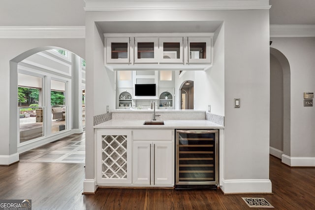 115 Hopewell Grove Dr, Milton, GA 30004 - indoor bar with wine cooler, ornamental molding, baseboards, and arched walkways