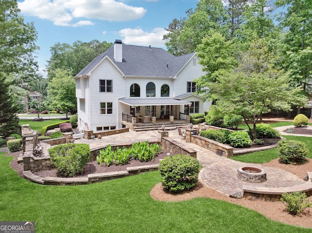 115 Hopewell Grove Dr, Milton, GA 30004 - back of house with a fire pit, a chimney, a yard, roof with shingles, and a patio area