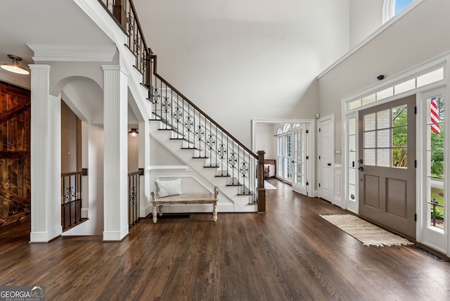 115 Hopewell Grove Dr, Milton, GA 30004 - foyer with a high ceiling, dark wood-style flooring, arched walkways, stairway, and baseboards