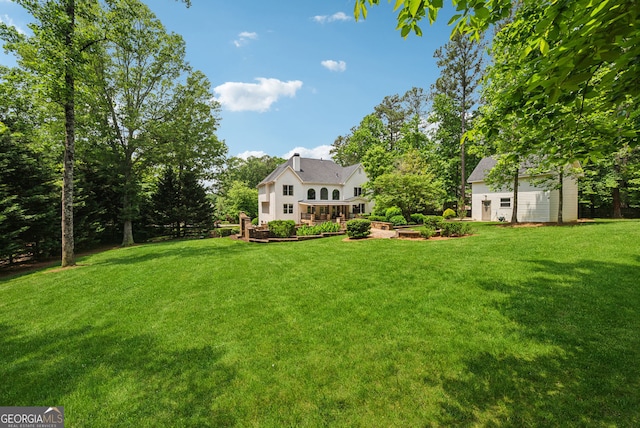 115 Hopewell Grove Dr, Milton, GA 30004 - view of green lawn featuring an outbuilding and a garden