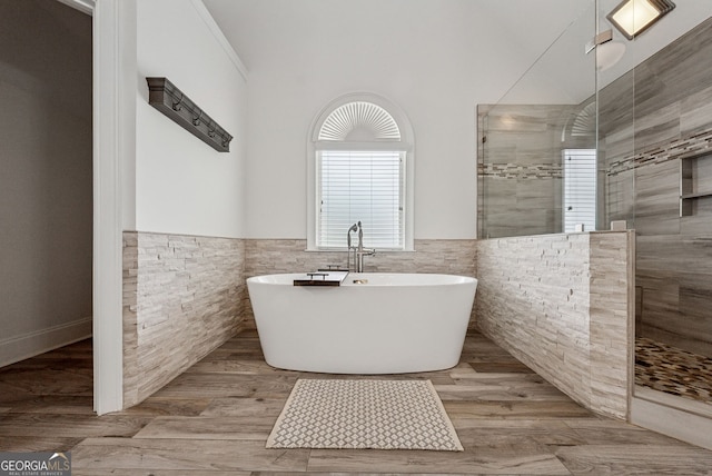 115 Hopewell Grove Dr, Milton, GA 30004 - full bath with a walk in shower, a soaking tub, healthy amount of natural light, a wainscoted wall, and tile walls