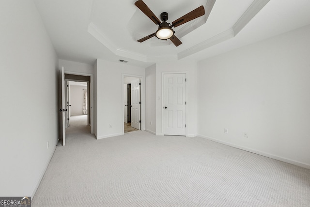 115 Hopewell Grove Dr, Milton, GA 30004 - unfurnished bedroom featuring a raised ceiling, light carpet, crown molding, ceiling fan, and baseboards