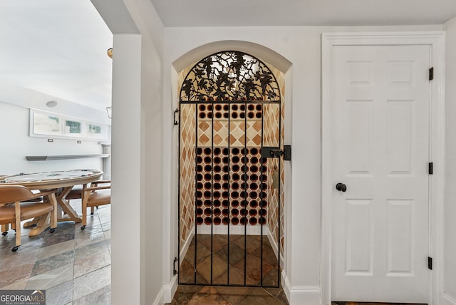 115 Hopewell Grove Dr, Milton, GA 30004 - wine area with stone tile floors and baseboards