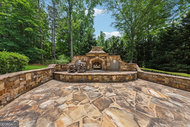 115 Hopewell Grove Dr, Milton, GA 30004 - view of patio / terrace with an outdoor stone fireplace